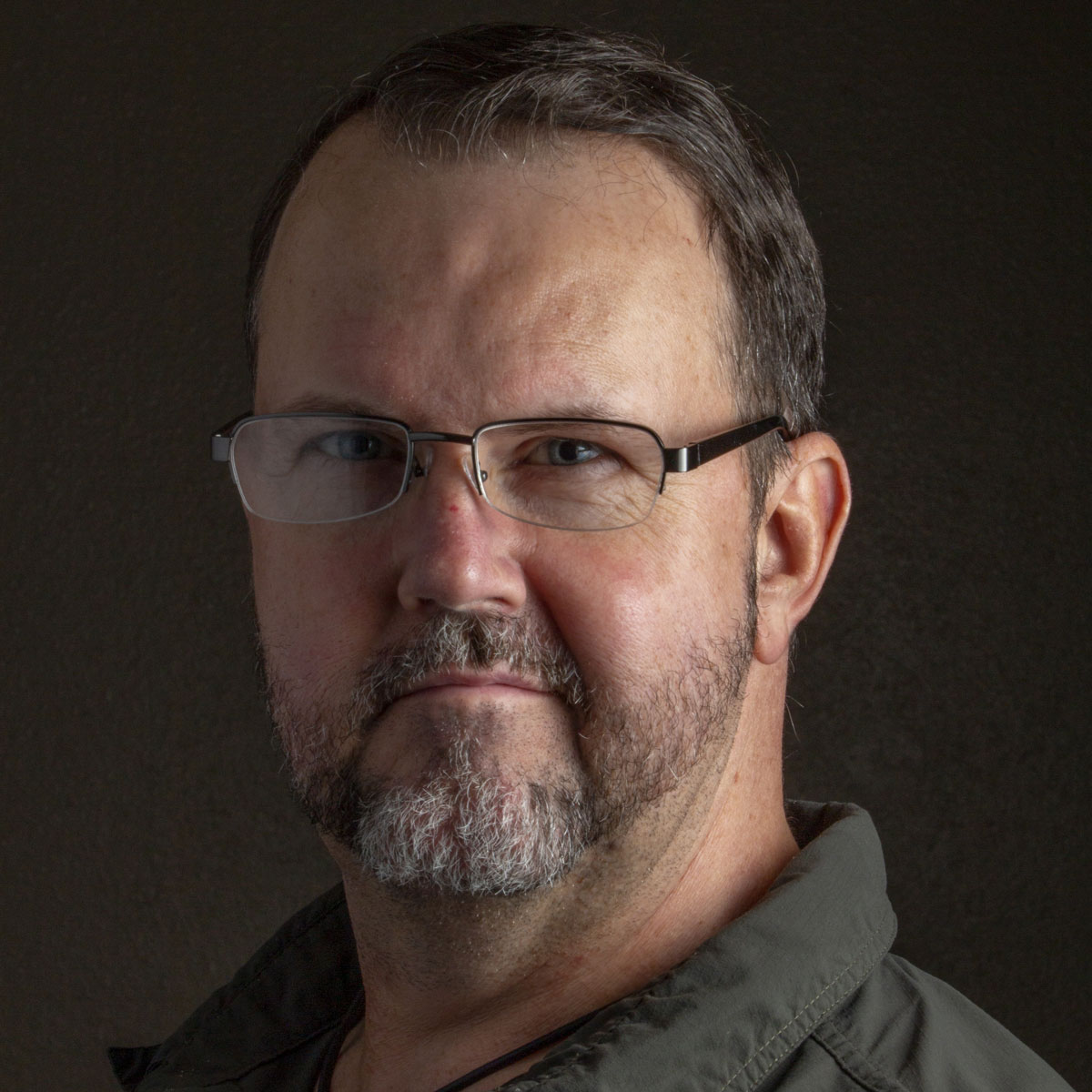 a self-portrait of Ben Sellars taken using two flashguns mounted inside softboxes